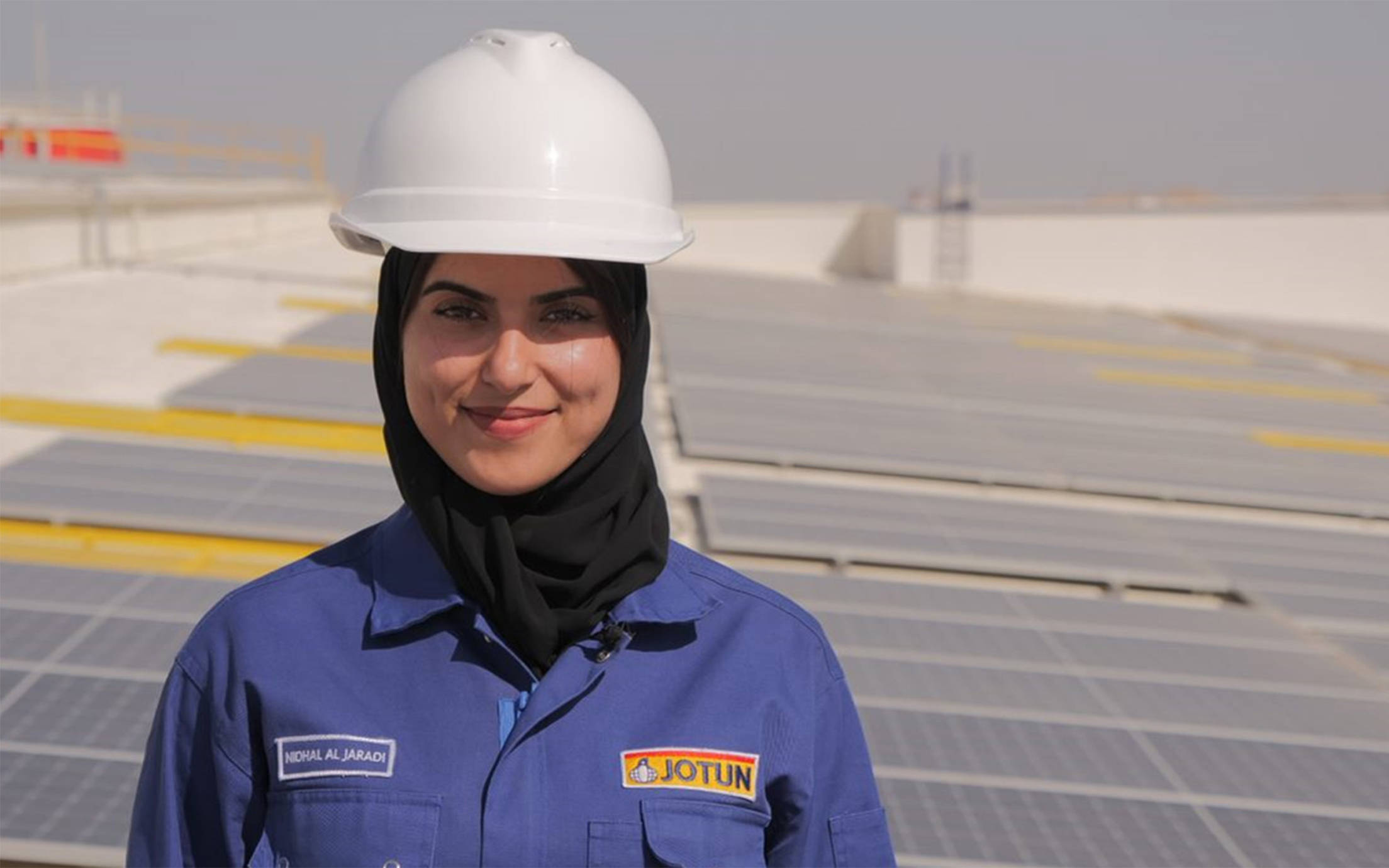 Woman on rooftop of the Jotun factory in Oman